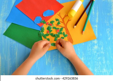 Child drew brown tree trunk  Child tears colored paper into small pieces  Torn paper edge  Torn paper art project for kids  Creativity lesson in kindergarten  Pencils  glue stick 