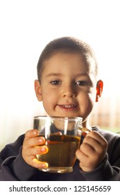 Child Drinking Tea