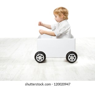 Child Driving Box Car. Creativity And Innovation Concept