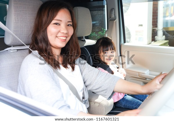 Child driving with\
mother