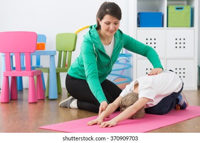 Child During Physiotherapy Exercises Woman Instructor Stock Photo ...