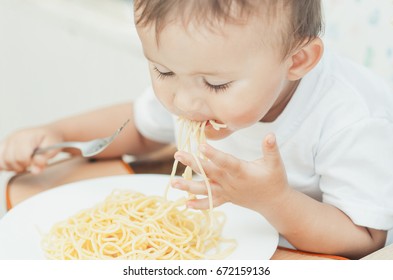 Child Eagerly Eats Delicious Pasta Kitchen Stock Photo 672159136 ...