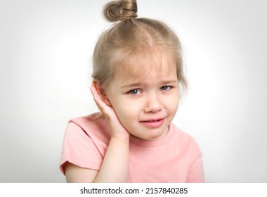 Child With Earache, Toddler Girl Portrait Ear Pain Concept. Kid With Medical Problems.