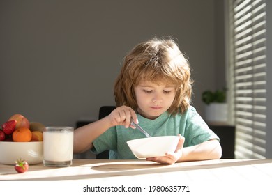 Child Eat. Little Healthy Hungry Boy Eating Soup From With Spoon.