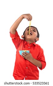 Child Eating Delicious Noodle, Indian Kid Eating Noodles With Fork On White Background