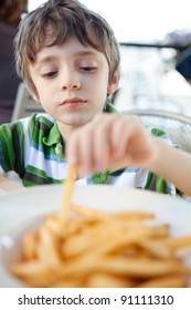 Child Eating French Fries