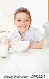 Child Eating Frosted Flakes At Breakfast