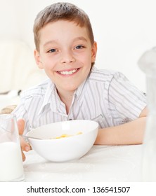 Child Eating Frosted Flakes At Breakfast