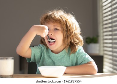 Child Eating Healthy Food At Home. Baby Eat Soup With Spoon.