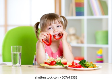 Child Eating Healthy Food In Kindergarten Or At Home