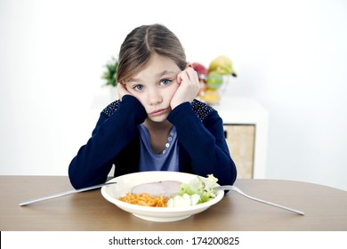 Child Eating A Meal