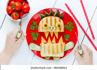 Child Eating Monster Sandwich For Breakfast. Funny Idea For Schoolboy Food