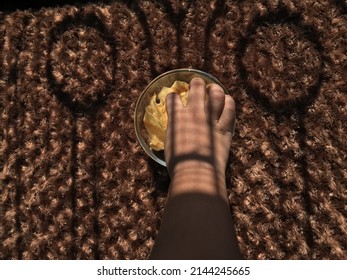 Child Eating Potato Chips In The Sun