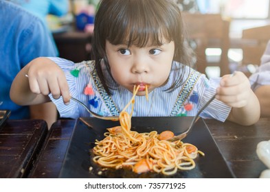 Child Eating Spaghetti In Morning Time