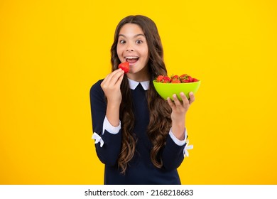 Child Eating A Strawberries. Happy Teen Child Picking Fruit Strawberry Bowl On Yellow Background. Healthy Natural Organic Vitamin Food For Kids, Strawberry Season.