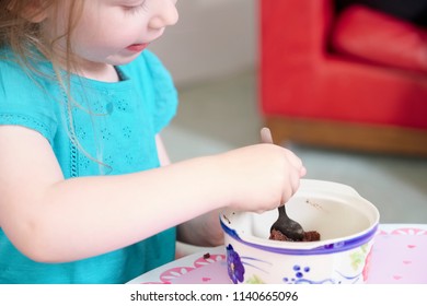 Child Eating Sweets Pudding Desert Chocolate Cake Young Kid Girl With Spoon And Dish Unhealthy