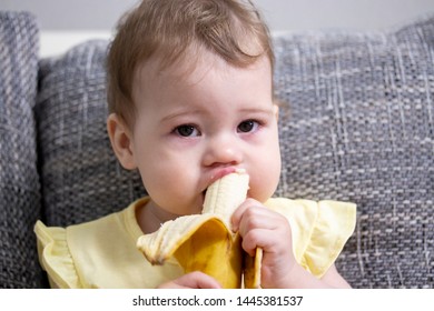 baby eating banana