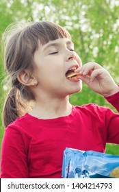 child eats chips. selective focus. food and drink.
