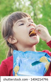 child eats chips. selective focus. food and drink.
