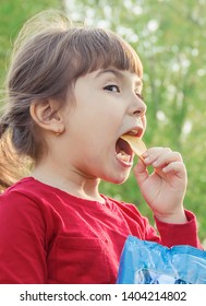 child eats chips. selective focus. food and drink.