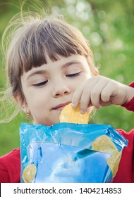 child eats chips. selective focus. food and drink.