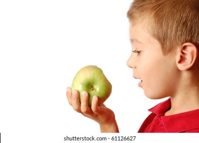 Child Eats Green Apple Isolated On White Background