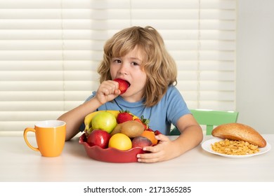 Child Eats Strawberry, Organic Fruits. Kid Bot Eating Meal. Healthy Nutrition For Children. Child Enjoy Eating For Breakfast Or Dinner With Appetite. Hungry Child Eat Tasty Fruits And Vegetables.