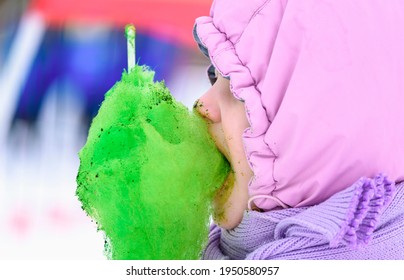 Child Eats Sweet Cotton Wool. Dirty Face Of Child After Eating