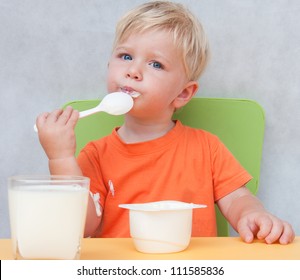 Child eats yogurt