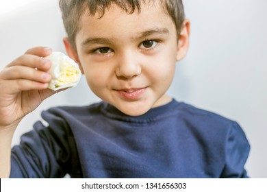 A Child With Egg. 5 Years Old Kid Eating Boiled Egg