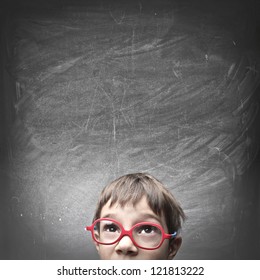 Child With An Empty Blackboard Over His Head