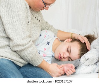 A child with epilepsy during a seizure - Shutterstock ID 1023137137