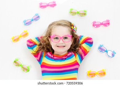 Child At Eye Sight Test. Little Kid Selecting Glasses At Optician Store. Eyesight Measurement For School Kids. Eye Wear For Children. Doctor Performing Eye Check. Baby With Spectacles Top View.