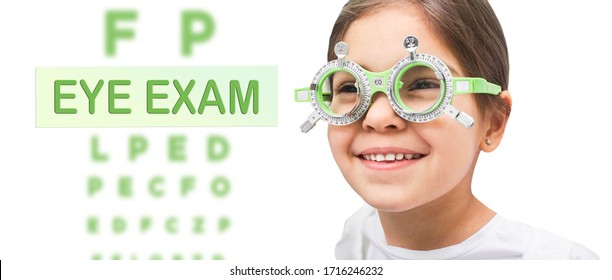 Child Eye Test And Eye Exam. Little Girl Having Eye Check-up, Wearing Special Glasses. Vision Diagnostic