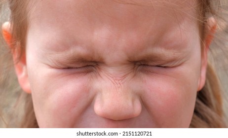 Child Face Close Up View. Little Girl  In Emotional Mental Stress Cry Feel Anxiety, Fear. Facial Expression Of Unhappy Scared Little Girl.