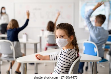 Child with face mask back at school after covid-19 quarantine and lockdown. - Powered by Shutterstock