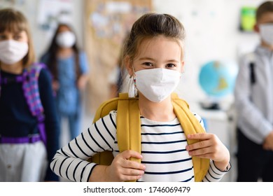 Child with face mask going back to school after covid-19 quarantine and lockdown.