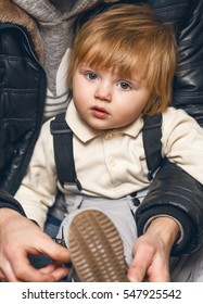 Child In The Father's Hands, Tying Shoes