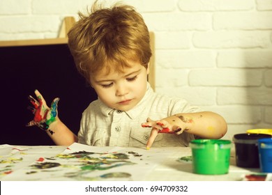 Child Fingerprint Art. Drawing For Children, Little Artists. Finger Paints, Free Time For Toddler. ?ice Talented Boy Draws A Yellow Paint In Children's Center In  Master Class Of Art. Creative Kid Boy