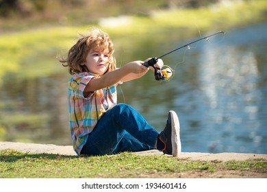 Child Fishing On The Lake. Kid Fisher Boy With Spinner At River. Portrait Of Excited Boy Fishing. Boy At Jetty With Rod. Fishing Concept