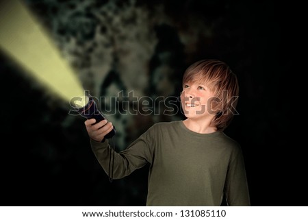 Similar – Image, Stock Photo Boy illuminated with lantern telling a terror story to surprised girl sitting in dark living room
