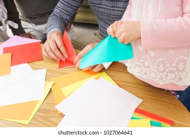 Child Folding Origami Paper