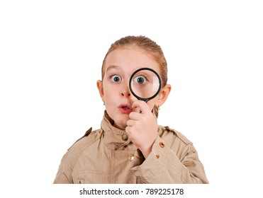 Child In The Form Of A Detective With Magnifying Glass On White Background