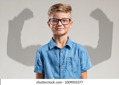 Child in front of big arms shadow