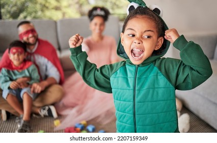 Child, Fun And Dress Up For Halloween With Energetic, Brave And Strong Girl Playing Dress Up Wearing Costume With Family At Home. Energetic, Playful And Imagination Of Kid During Pretend Game