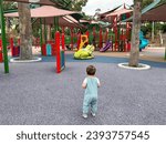 Child Gazing at Colorful Playground in MacArthur Park