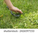 The child gently touched the snake with his hand