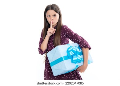 Child With Gift Present Box On Isolated Studio Background. Gifting For Kids Birthday. Serious Teenager Girl, Shhh Secret.