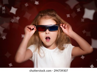 Child Girl In 3D Glasses Watching Movie.Kid In Cinema.