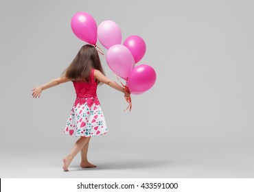 Child girl with balloons